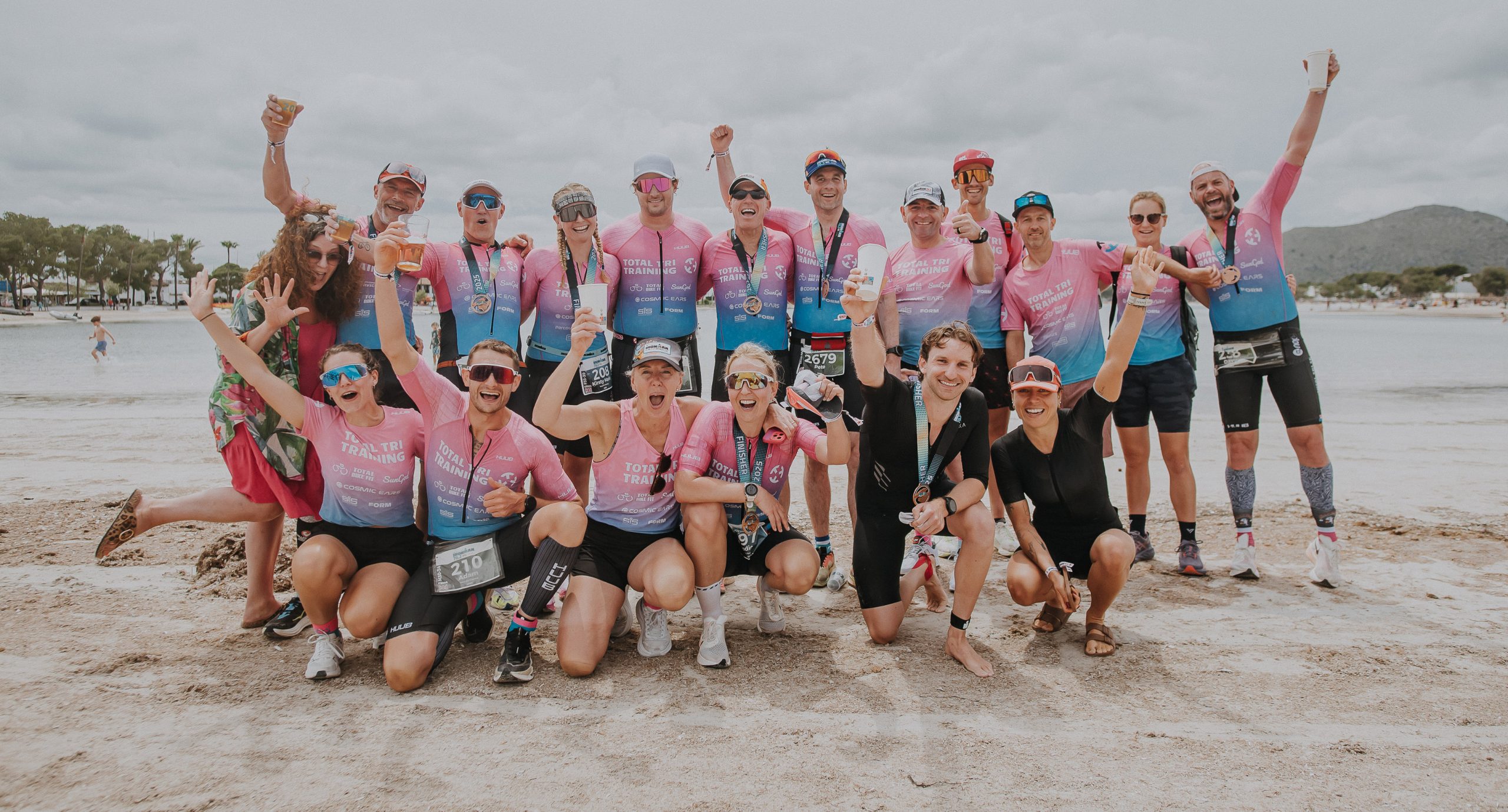 TTT athletes celebrating together on the beach